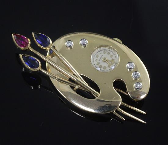 A Swiss 18ct gold, gem set novelty combination brooch with watch (dial signed Bucherer) modelled as an artists palette, 6cm.